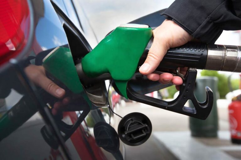 filling car with e-fuel from a green pump