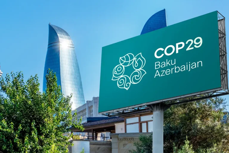 A COP29 billboard with the city of Baku as a backdrop.